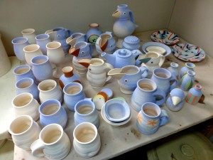 Bisque fired pots (two by Eric M at the back)